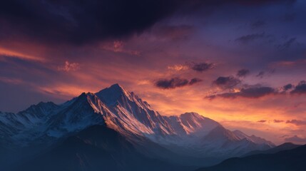 Snow capped mountain peaks at sunset with a dramatic colorful cloudy sky in the background