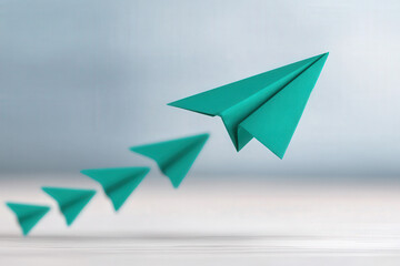 Business Growth Scaling Vision Concept, Business growth concept showing vision with origami paper airplane scaling upward turquoise blue