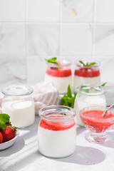 homemade yogurt in jars with strawberries