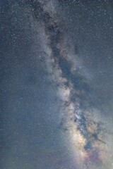 Brilliant Cosmic Nebula Stretching Across Starry Night Sky with Glowing Celestial Dust Clouds and...