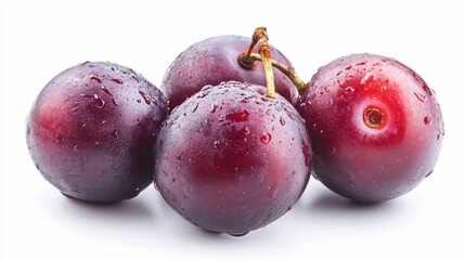 Obraz premium Plums glistening with moisture ripe and round