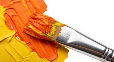 Closeup of a paintbrush with thick orange and yellow paint strokes, isolated on white background