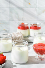 homemade yogurt in jars with strawberries