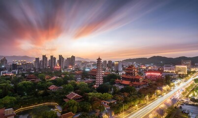 Naklejka premium Modern Chinese city skyline with traditional pagoda at sunset and dramatic light trails over mountains