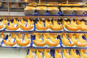 Cantaloupe Composition: Fresh Melon Display in Bright Retail Case