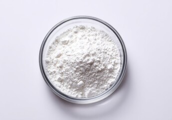 Clear glass bowl of white flour