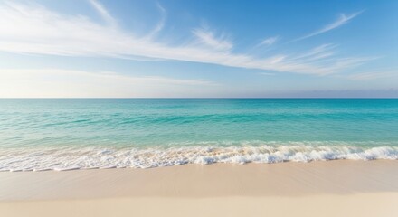Fototapeta premium Beautiful Tropical Beach with Gentle Waves Under a Clear Blue Sky