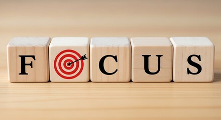 Wooden blocks spell focus with target symbol representing goal achievement success strategy