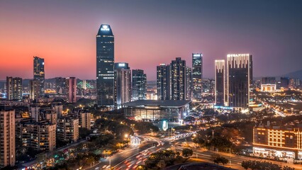 Huizhou Jiangbei CBD Skyline at Twilight - Aerial View of Illuminated Skyscrapers and Urban Cityscape