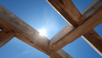 Wooden beams against a bright blue sky