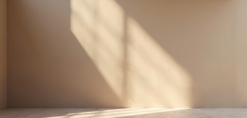 Smooth taupe wall interior, bathed in soft light, casting diagonal shadows, creating subtle texture. Minimalist background with marble floor pattern, ideal for modern design, decor, architectural