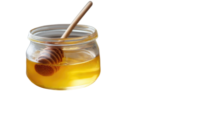 Golden Nectar: A close-up shot of a glass jar filled with golden, viscous honey, a wooden honey dipper gently resting within. This image is a visual treat.