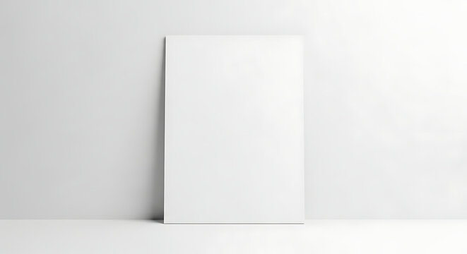 Clean and modern vertical blank white canvas or poster mockup leaning against a pristine wall in a minimalist interior setting, ideal for custom artwork or branding display