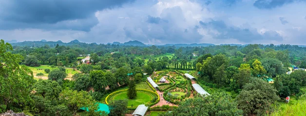 Fototapete Rund Naturpark Panoramic view of Pachmarhi valley having clouds and mist shrouded hills rolling on each other from Pandava Caves top point in Pachmarchi, Madhya Pradesh, India.  © anjali04