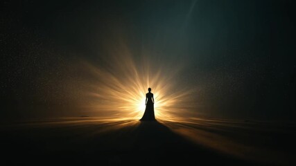 Person standing in silhouette with radiant light background  
