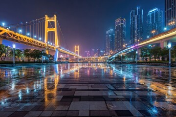 Fototapeta premium Night cityscape with illuminated bridge and reflected lights