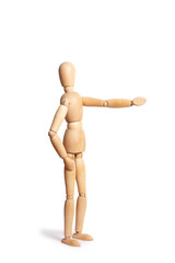 A wooden toy mannequin doing gesture of showing something isolated on a white background with copy space