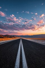 Naklejka premium Empty road stretching into a vibrant sunset