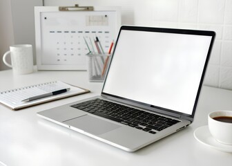 Fototapeta premium Modern laptop on a desk with office supplies