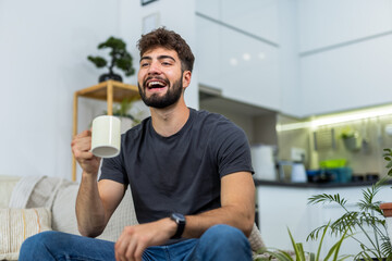 Young man enjoying morning coffee in his cozy home