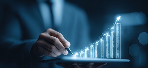 Businessperson holding a tablet with a glowing bar graph of increasing numbers