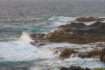 Fototapeta premium An interesting geological formation on the east coast of Gran Canaria, right on the border of the mainland and the ocean. Spain El Bufadero