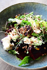 close up of fresh salad with vegetables on plate
