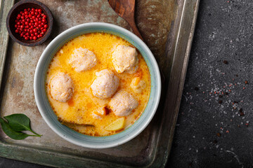 Soup with meatballs, potatoes and cheese. Meatballs in thick vegetable soup Albondigas. Mexican and Spanish, European and Russian cuisine. Grey background