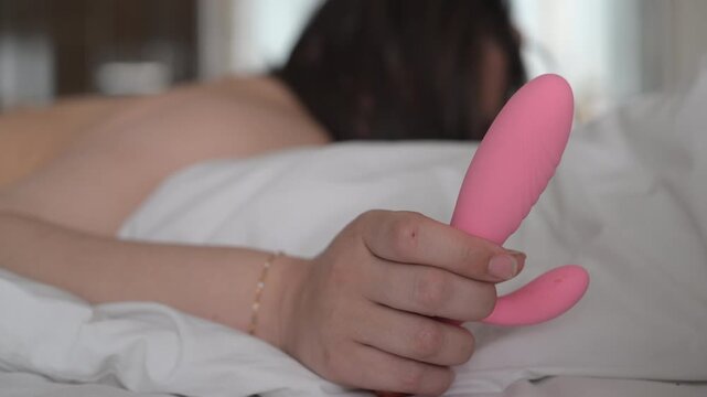 Woman seen holding a vibrator in her hand 