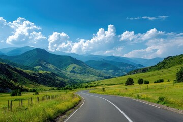 Naklejka premium Winding road through verdant mountains under a vibrant sky