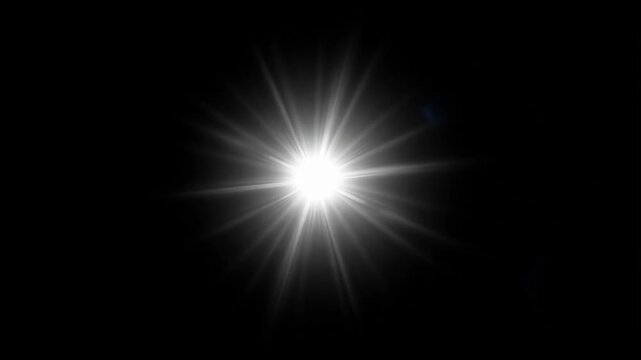 Bright starburst of light radiating from a central point against a dark background