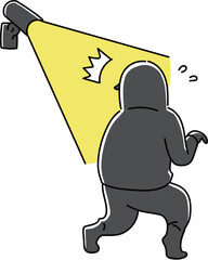 センサーライトに照らされる泥棒