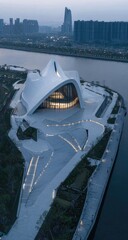 Modern architectural complex by a river at twilight