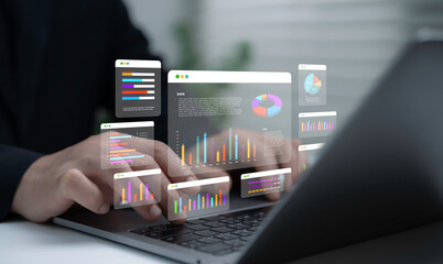 Businessman analyzing digital data dashboard with interactive graphs and charts on laptop screen representing financial report analytics strategy and modern technology for business growth
