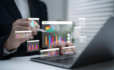 Businessman analyzing interactive data dashboard with graphs and charts on laptop using digital pen representing financial report business analytics strategy and modern technology for decision making