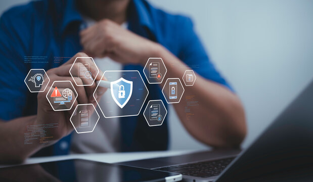 Person using laptop with digital cybersecurity interface and lock icon hologram representing data protection privacy network security and modern technology for safe online communication