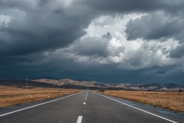 Empty road under a stormy sky