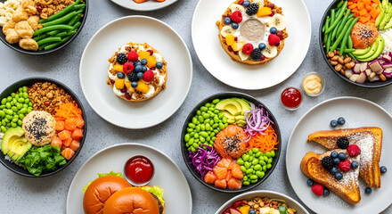 Overhead shot of various healthy food bowls and plates, including salads, sandwiches, and desserts colorful and nutritious options for a balanced diet