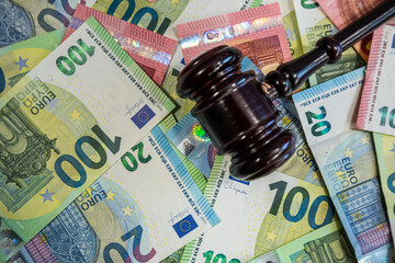 Scattered 100 euro bills representing European currency, financial security, and economic power