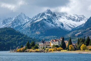 Scenic lakefront hotel nestled at the base of snow-capped mountains