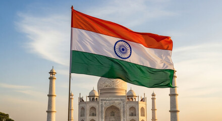 Majestic Indian flag waves proudly before the iconic Taj Mahal monument at sunrise