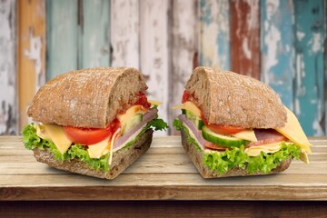 Tasty fresh cheese sandwich on wooden desk