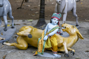 Murthis (statues) in Govardhan Ecovillage, Maharashtra, India. Krishna defeating Dhenuka Sura