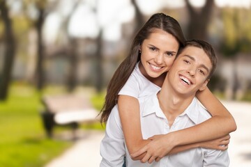 Obraz premium Portrait of attractive cheerful couple enjoying outdoors