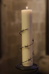 Canterbury cathedral, Kent, U.K. Candle placed by Amnesty International as a reminder of prisoners...