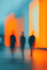 Fototapeta premium Blurry silhouettes of people walking in night-lit atrium, glowing panels, light trails, immersive atmosphere