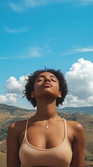 Serene Woman with Eyes Closed Enjoying the Warm Sun Against a Blue Sky