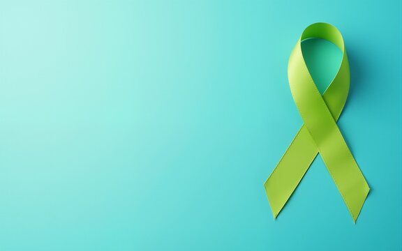 September World lymphoma and October Mental health day Awareness month, lime green Ribbon color on blue background for supporting people living, and illness. Healthcare concepts. High quality - Powered by Adobe