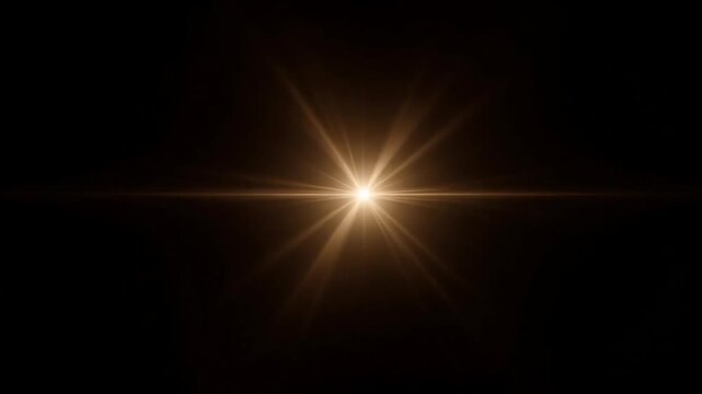 Bright golden starburst lens flare emanating from a central light source against a dark background