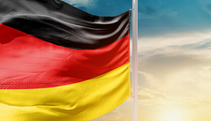Germany national flag waving in an amazing sunlight. National flag wavering on mast.